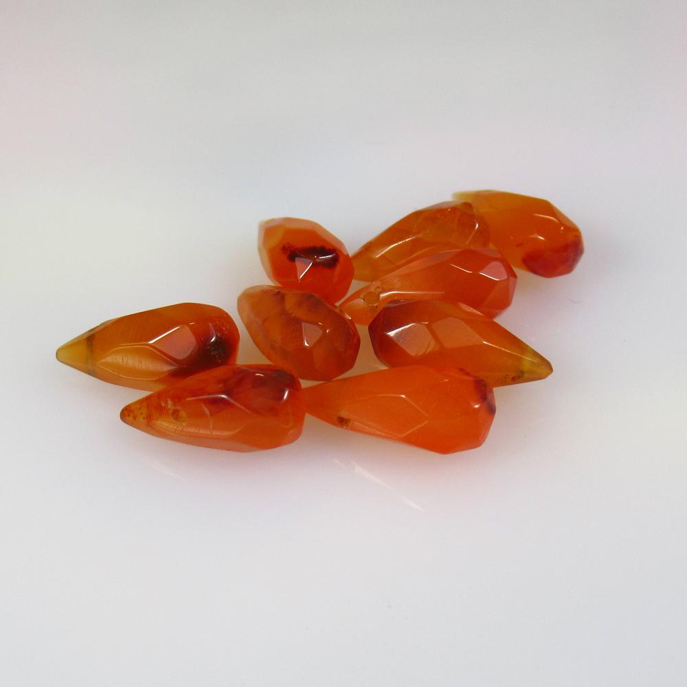 20.00 Ctw Natural 9 Drilled Orange Carnelian Pear Drop: Title: 20.00 Ctw Natural 9 Drilled Orange Carnelian Pear Drop Beads Stone Clarity: Semi-Transparent Gemstone: Natural Carnelian Beads Carat Weight: 20 Size/Dimensions: 11.5x5.5 - 14.0x5.5 mm / 9 PC's 