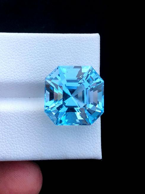 Topaz Gemstone ~ Natural Asscher Cut Bluetopaz gemstone: Topaz Gemstone ~ Natural Asscher Cut Bluetopaz gemstone Video Link : https://www.instagram.com/p/CPi4sMJhJVW/ Dimensions (mm) ~ 15*15*12 mm Weight (carats) ~ 18.90 Carats Origin : Skrdu Pakistan DHL G