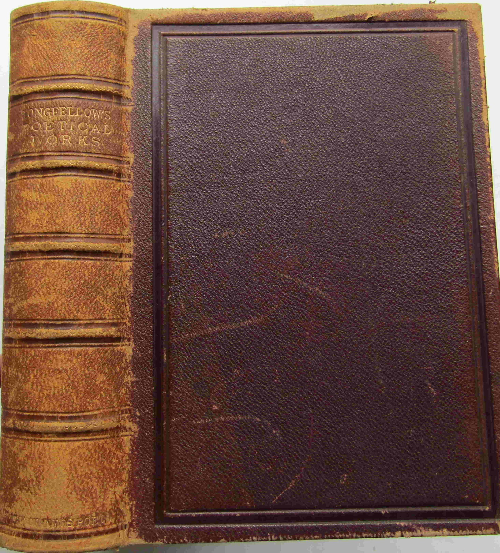 The Poetical Works of Henry Wadsworth Longfellow: First edition. Publishers full brown leather with blind-stamped borders. [some wear]. Gilt title and gilt raised bands to spine. Triple gilt page-blocks. Marbled endpapers and gilt dentelles. Name and