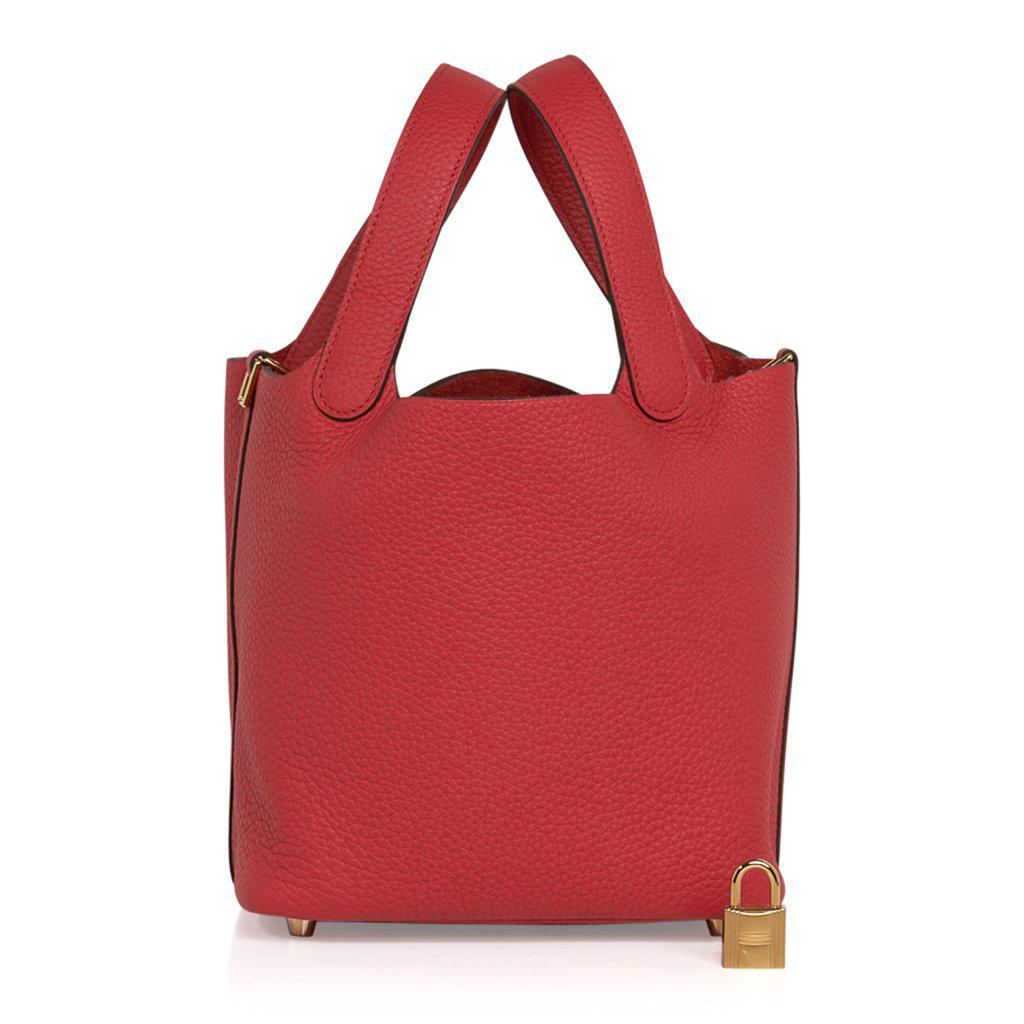 Hermes Picotin Lock 18 Bag Rouge Tomate Tote Clemence: Guaranteed authentic Hermes Picotin Lock 18 tote bag featured in Rouge Tomate. Clemence leather with Gold hardware. This roomy small tote is a perfect go to bag! Comes with lock and keys, sleeper, and