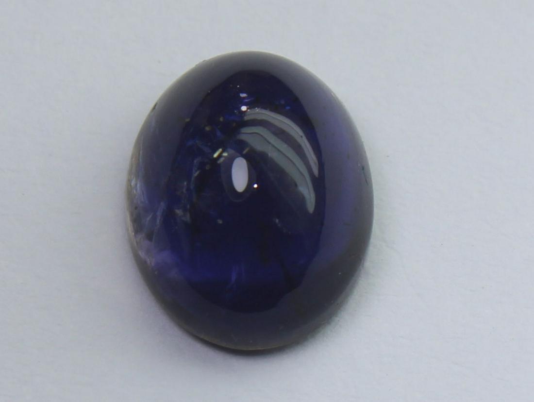 2.24 Cts Natural Iolite: No Reserve! Title: 2.24 Cts Natural Iolite Additional Information: Gemstone: Natural Iolite Weight: 2.24 Carats Measurements: 9.5x7.2x4.8 mm Shape / Cut: Oval Cabochon Colour: Violet Blue Transparency