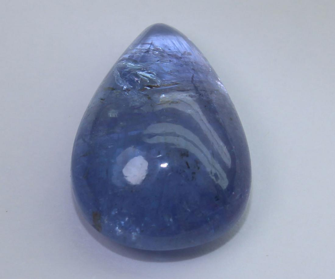9.10 Cts Natural Tanzanite: No Reserve! Title: 9.10 Cts Natural Tanzanite Additional Information: Gemstone : Natural Tanzanite Origin : Tanzania Weight : 9.10 carats Dimensions : 15.6x11x6.5 mm Shape : Pear Cabochon Color : Viol
