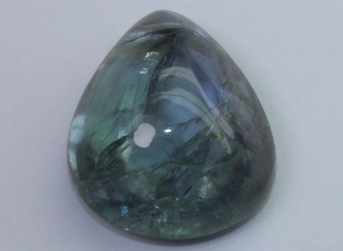 9.95 Cts Natural Tanzanite: No Reserve! Title: 9.95 Cts Natural Tanzanite Additional Information: Gemstone : Natural Tanzanite Origin : Tanzania Weight : 9.95 carats Dimensions : 14.8x12.3x6.9 mm Shape : Pear Cabochon Color : Gr