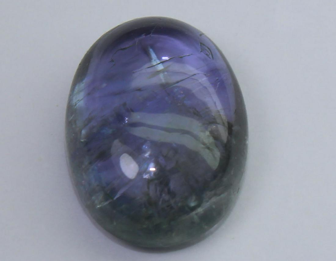 8.42 Cts Natural Tanzanite: No Reserve! Title: 8.42 Cts Natural Tanzanite Additional Information: Gemstone : Natural Tanzanite Origin : Tanzania Weight : 8.42 carats Dimensions : 14.3x10.6x5.6 mm Shape : Oval Cabochon Color : Vi