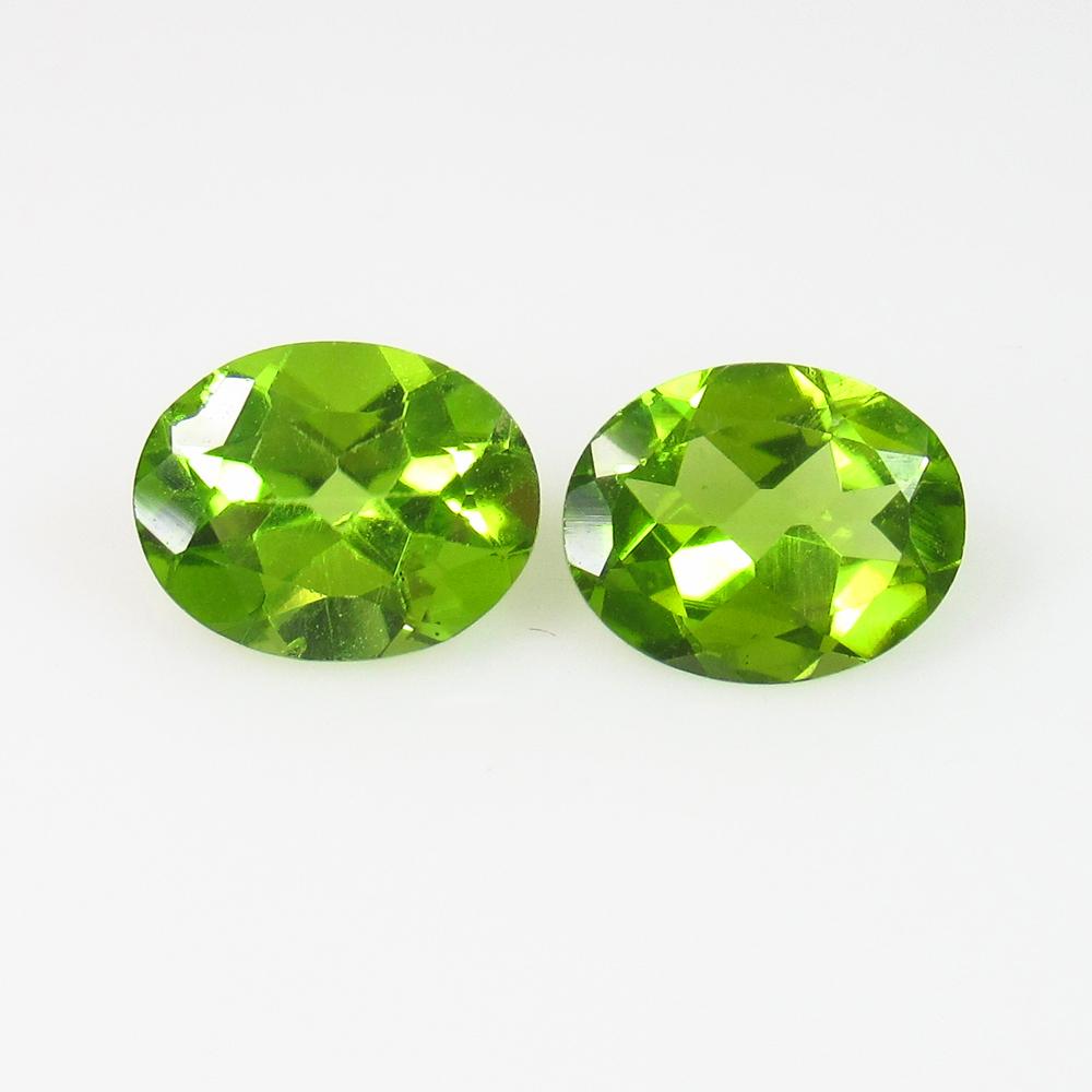 IGI Certified 3.50 Ct Natural Peridot Oval Pair: No Reserve! Title: IGI Certified 3.50 Ct Natural Peridot Oval Pair Stone Clarity: Transparent Gemstone: Natural Peridot Carat Weight: 3.50 Size/Dimension: 8.85 x 7.07 x 3.70 mm Additional Information: