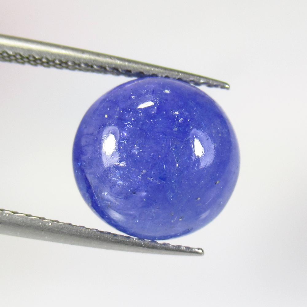 6.58 Ct Natural Tanzanite Round Cab: No Reserve! Title: 6.58 Ct Natural Tanzanite Round Cab Stone Clarity: Semi-Transparent Gemstone: Natural Tanzanite Carat Weight: 6.58 Size/Dimension: 9.80 x 9.80 x 5.70 mm Additional Information: Top 