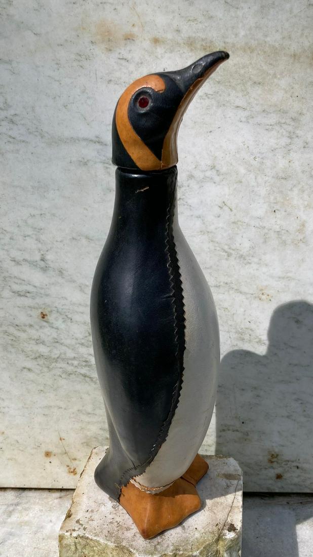Mid 20thc penguin leather covered wine bottle: Title: Mid 20thc penguin leather covered wine bottle Dimension: 14" high Additional Information: Italian. GC with minor use wear to leather trimming. Shipping: Domestic: Flat-rate of $20.00 to anywher