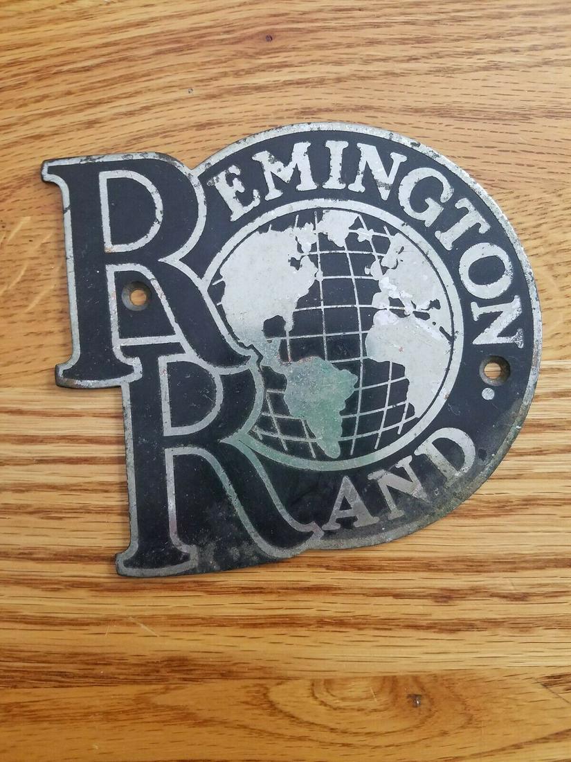 Remington rand sign 4" graphic world globe: Great looking piece in excellent condition. Brass. Thicker metal. Shipping includes insurance. Shipping: Domestic: Flat-rate of $12.00 to anywhere within the contiguous U.S. International: Foreign shi