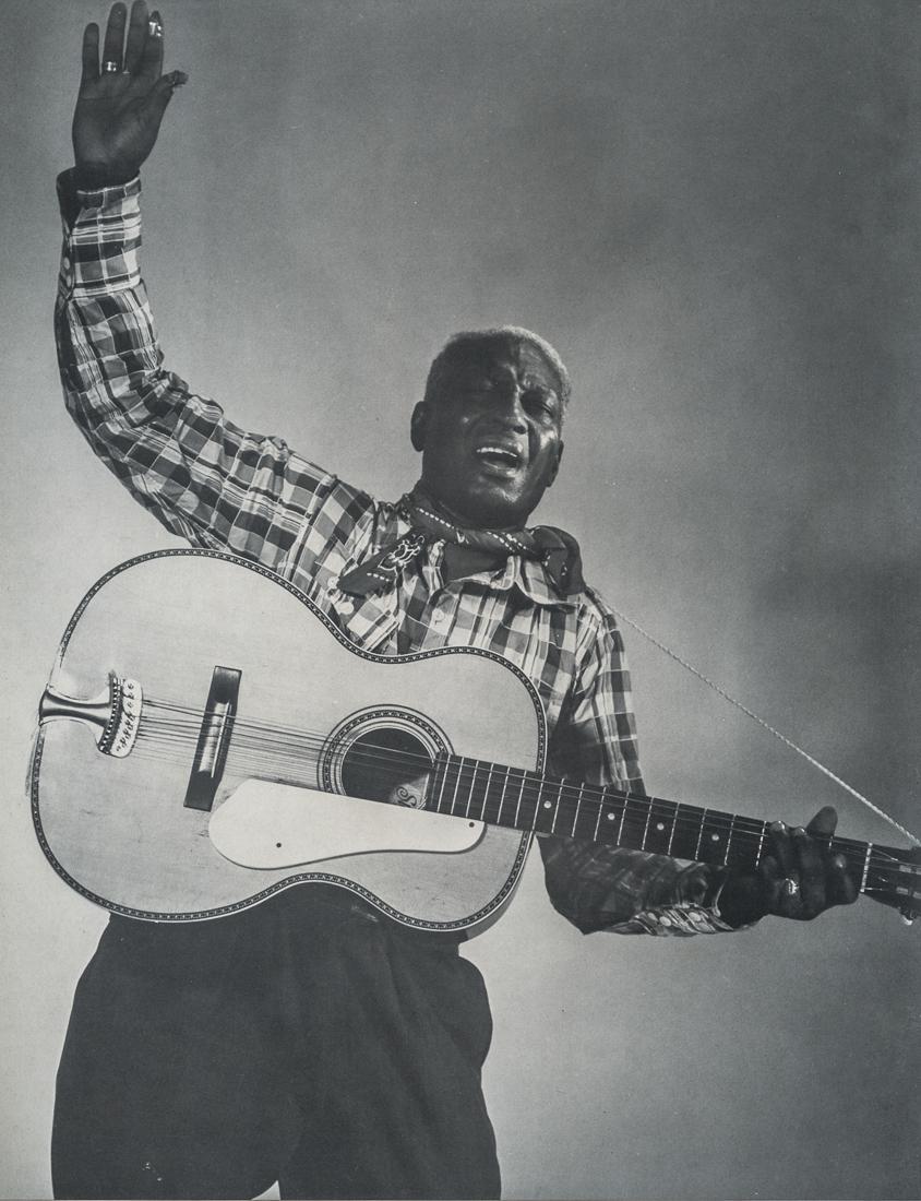 BERENICE ABBOTT - Leadbelly (Huddie Ledbetter): Artist: Berenice Abbott Title:Leadbelly (Huddie Ledbetter) Medium: Photo Litho, 1970, USA Dimensions: 7.5x9.6" Description: Heat Wax Mounted on 11x14" Conservation Board Artist Bio: Berenice Abbot, or