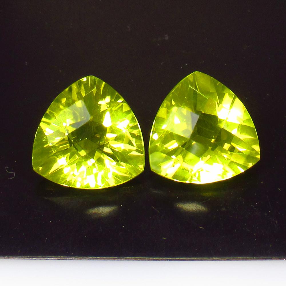 12.57 Ctw Natural Lemon Quartz Trillion Pair: Title: 12.57 Ctw Natural Lemon Quartz Trillion Pair Stone Clarity: VVS Gemstones: Lemon Quartz Size/Dimensions: 12.57 Carat Weights: 13.00 x 13.00 x 7.90 mm / 2 Pc's Additional Information: Good Luste