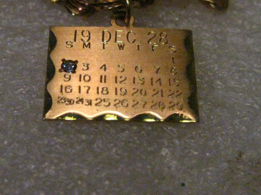 Vintage 14kt Solid Gold December 2, 1928 Birthday: Vintage 1940-1950's 14kt Solid Gold Birthday Charm or Pendant - Dec. 2, 1928 (but from appx. 1940-1950's). This has a zircon - birthstone for December in the 2 position for the birthday. This is signe