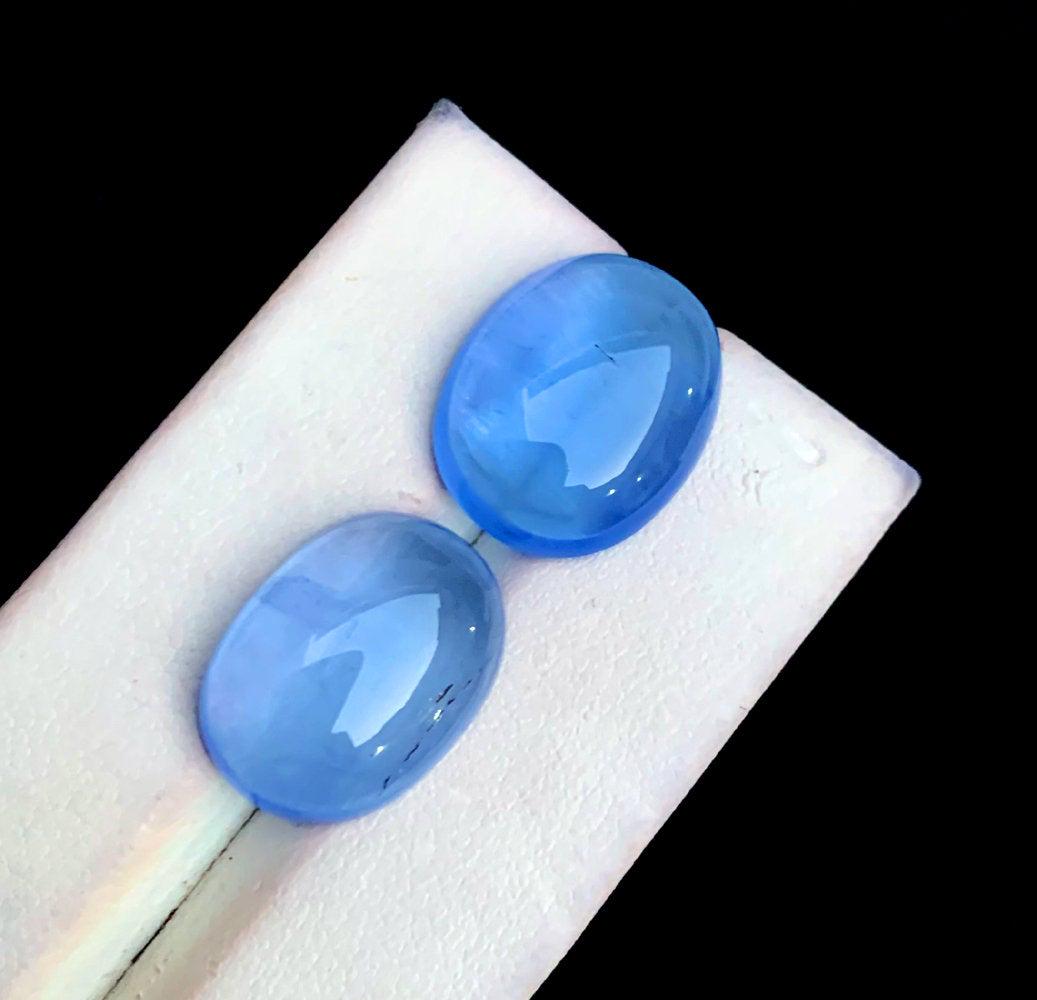 Natural Blue Aquamarine Cabochon Pair - 21.50 Carats -: Natural Blue Aquamarine Cabochon - Weight : 21.50 cts Dimensions : 17*14*06 mm Locality : Pakistan Color : Blue Treatment : Natural DHL Ecommerce Shipping D4-180 Reserve: $165.00 Shipping: D