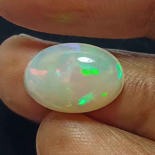 2.45 CTS NATURAL ETHIOPIAN WELO WHITE OPAL OVAL SHAPE: Title: 2.45 CTS NATURAL ETHIOPIAN WELO WHITE OPAL OVAL SHAPE GOOD LUSTER LOOSE GEMSTONES Carat Weights: 2.45 Size/Dimensions: 12.5 x 8.7 x 4.3 MM Reserve: $30.00 Shipping: Domestic: Flat-rate of $10.0