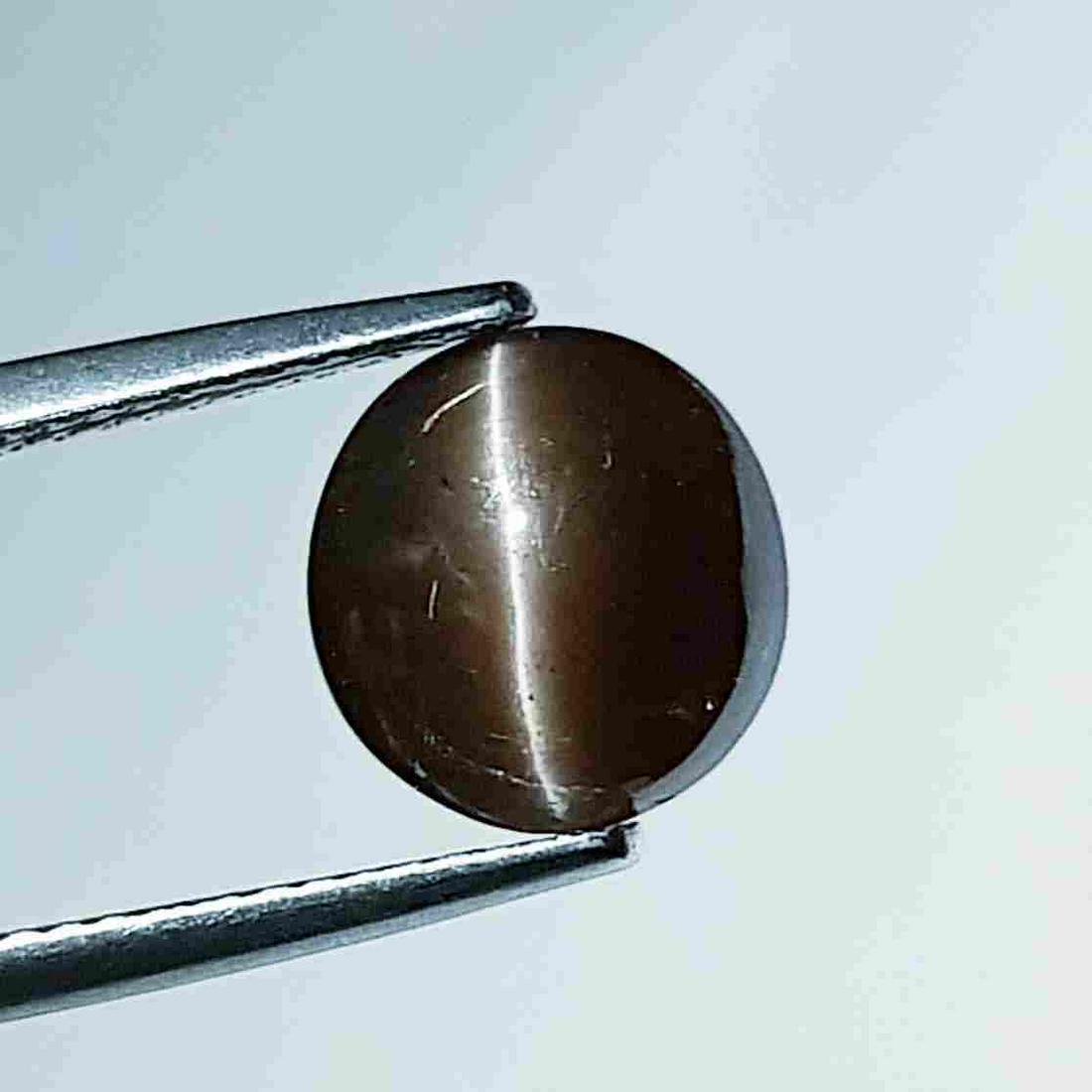 3.90 ct Natural Scapolite Cat's Eye: No Reserve! Title: 3.90 ct Natural Scapolite Cat's Eye Color/Clarity: Opaque Carat Weight: 3.9 Size/Dimensions: 9.50 x 9.20 x 7.00 Additional Information: Round - Africa Shipping: Domestic: Flat-rat