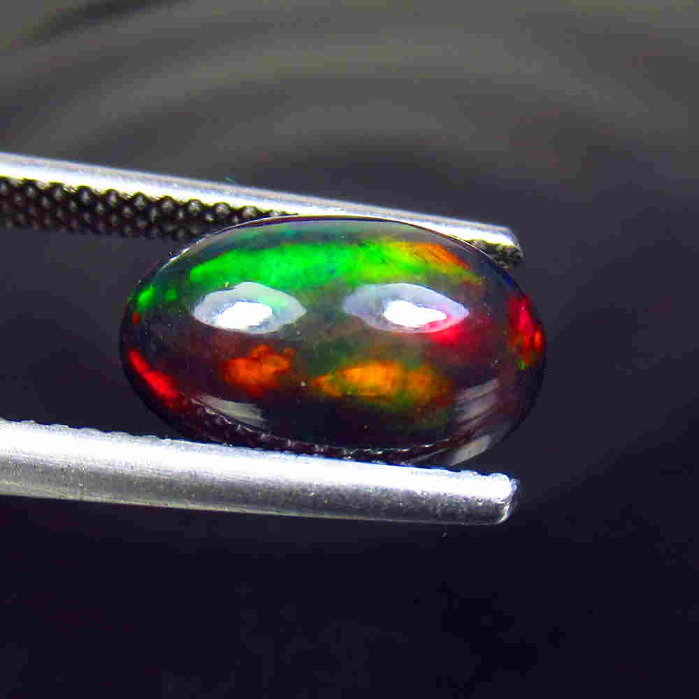 2.54 Ctw Natural Ethiopian Black Fire Opal Oval Cab: No Reserve! Title: 2.54 Ctw Natural Ethiopian Black Fire Opal Oval Cab Stone Clarity: Translucent Gemstone: Black Opal Carat Weight: 2.54 Size/Dimensions: 12.80 x 7.90 x 4.80 mm Additional Information