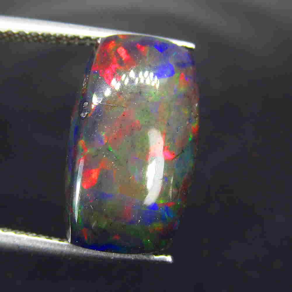 3.94 Ctw Natural Ethiopian Black Fire Opal Cushion Cab: No Reserve! Title: 3.94 Ctw Natural Ethiopian Black Fire Opal Cushion Cab Stone Clarity: Translucent Gemstone: Black Opal Carat Weight: 3.94 Size/Dimensions: 14.30 x 8.90 x 4.70 mm Additional Informat