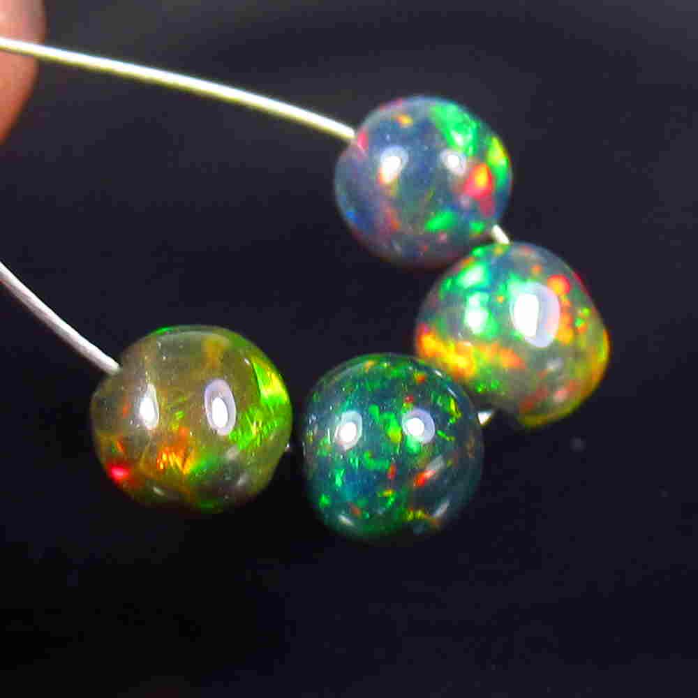 1.84 Ctw Natural 4 Drilled Black Opal Ball Beads: No Reserve! Title: 1.84 Ctw Natural 4 Drilled Black Opal Ball Beads Stone Clarity: Translucent Gemstone: Black Opal Beads Carat Weight: 1.84 Size/Dimensions: 4.50 to 5.00 mm / 4 PC's Additional Inform