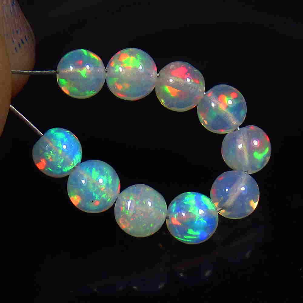 3.30 Ct Natural 10 Multi-Color Fire Opal Ball Beads: No Reserve! Title: 3.30 Ct Natural 10 Multi-Color Fire Opal Ball Beads Stone Clarity: Translucent Gemstone: Fire Opal Beads Carat Weight: 3.30 Size/Dimensions: 4.10 to 4.40 mm / 10 PC's Additional Inf