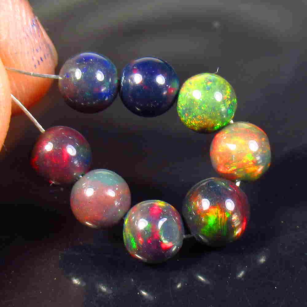 5.65 Ctw Natural 8 Drilled Black Opal Ball Beads: No Reserve! Title: 5.65 Ctw Natural 8 Drilled Black Opal Ball Beads Stone Clarity: Translucent Gemstone: Black Opal Beads Carat Weight: 5.65 Size/Dimensions: 5.30 to 6.00 mm / 8 PC's Additional Inform