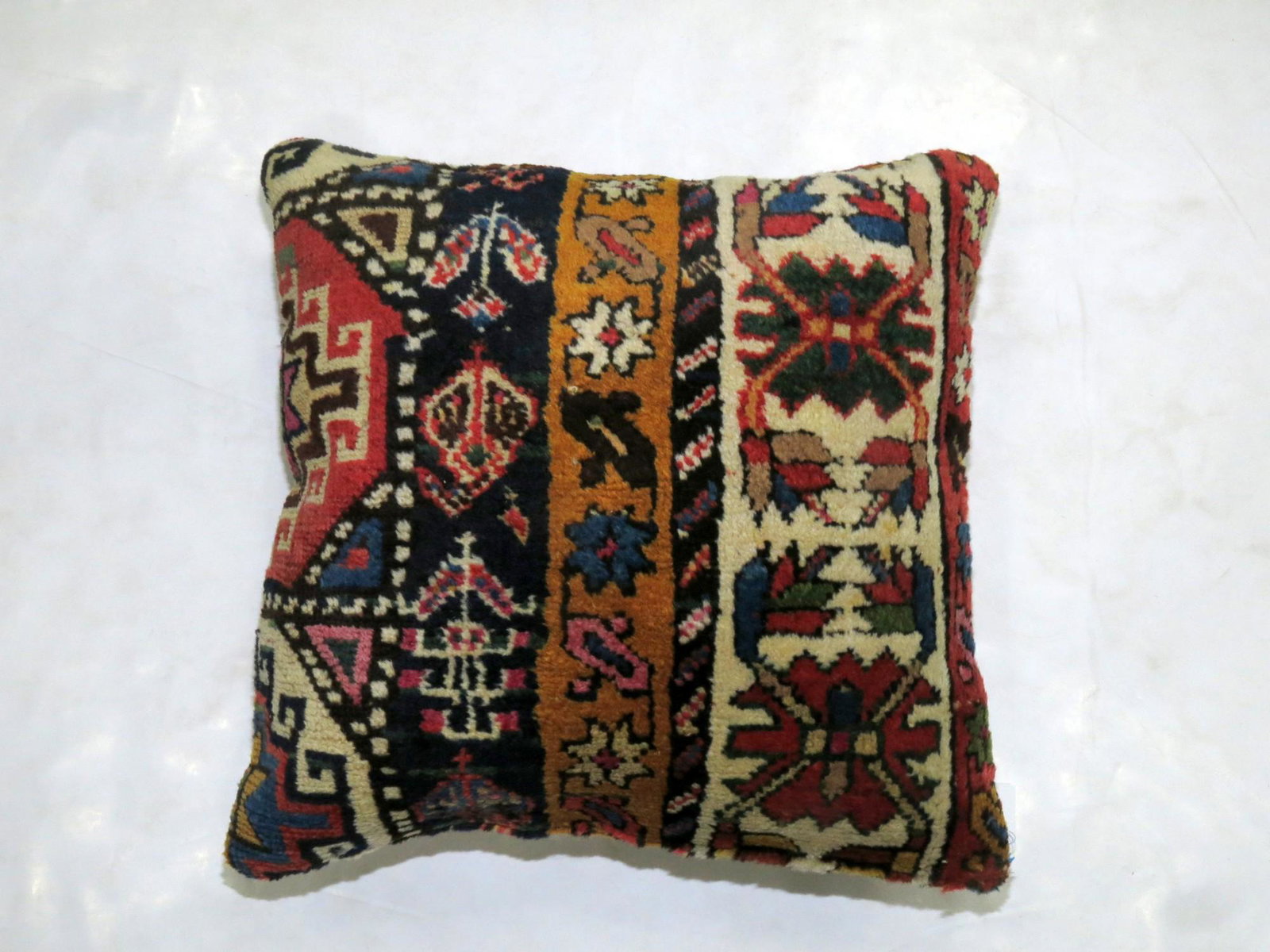 Caucasian Rug Pillow: Description Pillow made from a caucasian Rug Details rug no. p3863 size 1' 6" x 1' 7" (46 x 48 cm) rug type Caucasian,Pillow size / category Pillows Reserve: $99.00