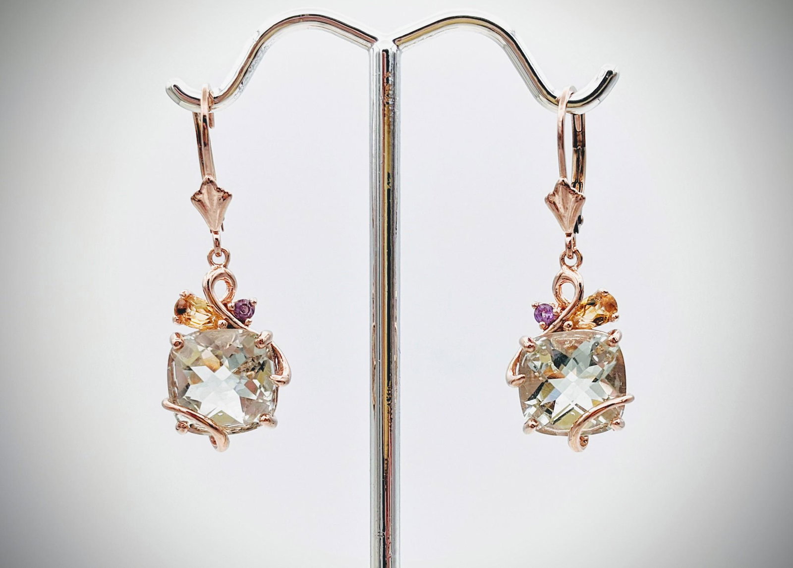 Rose Gold Earrings w Hiddenite, Morganite & Amethyst: Brand: Jean Lin Collection Title: Rose Gold Earrings w Hiddenite, Morganite & Amethyst Metal Purity: Rose Gold Plated 925 Sterling Silver Gemstones: Hiddenite, Morganite & Amethyst Carat Weights: Each