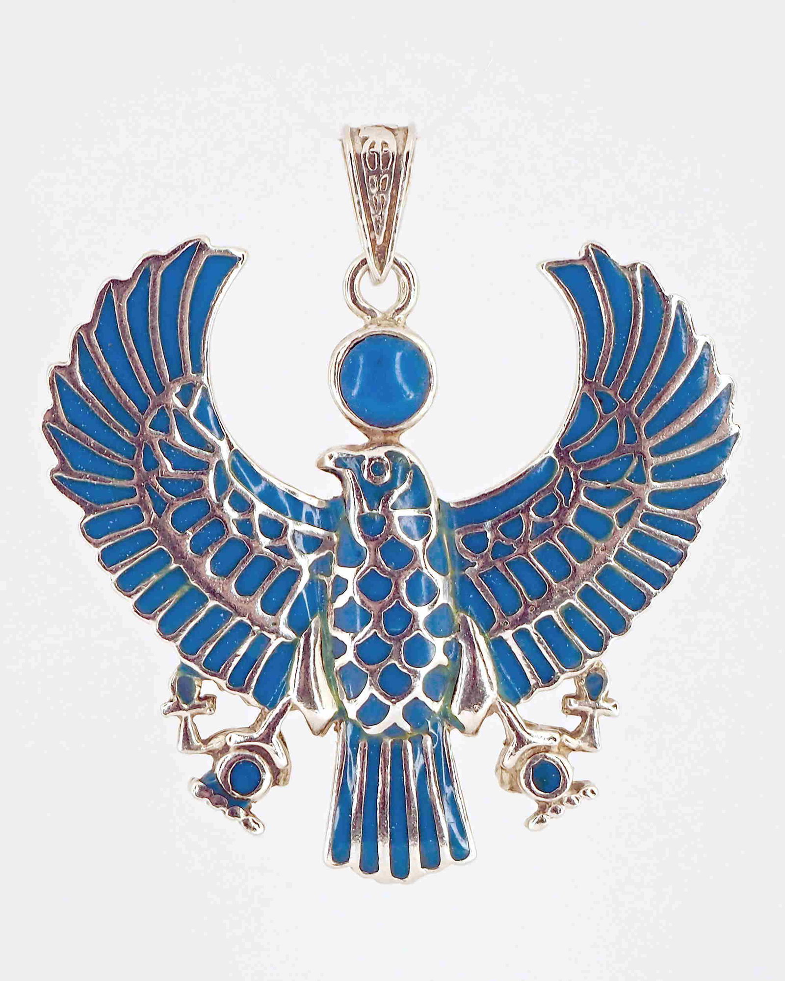 Egyptian lapis lazuli falcon pendant: Title: Egyptian lapis lazuli falcon pendant Additional Information: Stamped sterling silver Egyptian falcon pendant inlaid with lapis lazuli - 13.97 grams - H 4 x W 4 cm Materials: Sterling silver, la