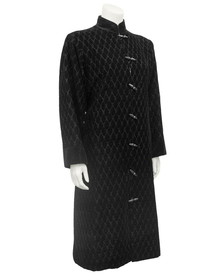 Yves Saint Laurent Yves Saint Laurent Black quilted: Yves Saint Laurent Rive Gauche robe stye coat from the 1980s. Black velvet with top stitching creating all over diamond quilting. Non quilted black velvet Mandarin collar, black cuffs and matching bel
