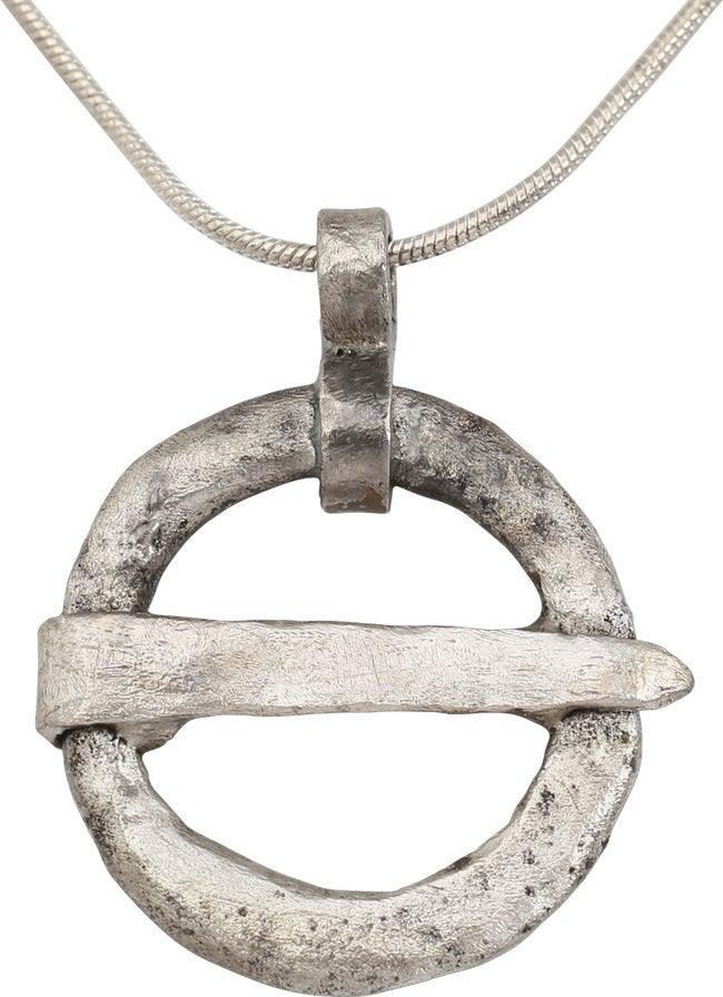 VIKING PROTECTIVE ARMOR BROOCH NECKLACE10th-11th: Silvered bronze. Just under 1” diameter. Oval section with ridged outed edge and tapered cross pin which is inscribed with three marks. When fastened to the jerkin, these small metal brooches pr