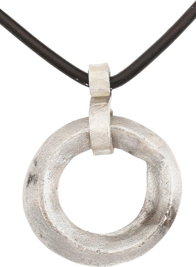 VIKING PROTECTIVE ARMOR BROOCH NECKLACE, 10th C.AD: Silvered bronze, about 7/8” diameter. Circular of very heavy diamond section resulting in ridged edges, in and out. Professionally refurbished with the silver overlay restored, on a modern polis