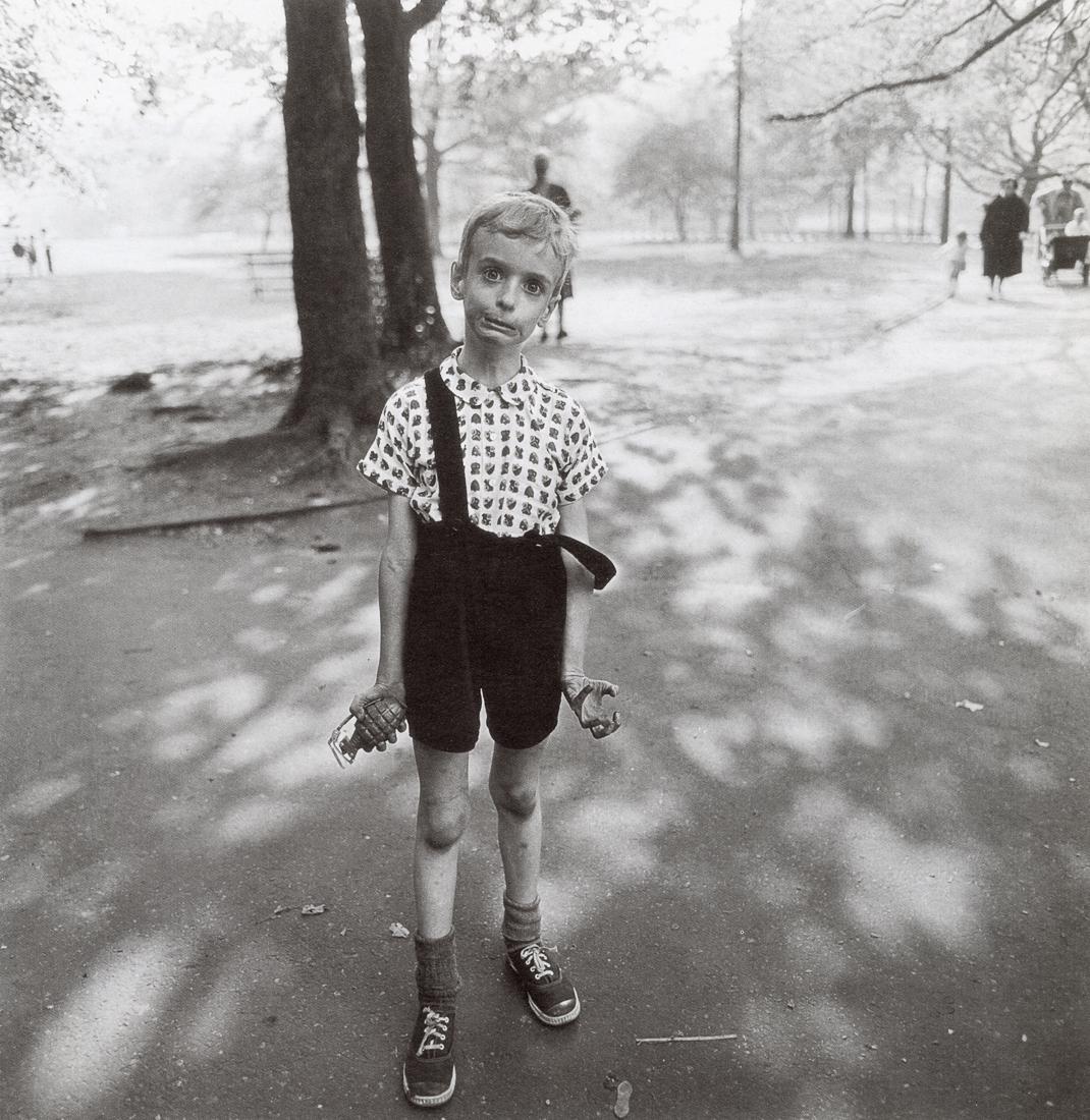 DIANE ARBUS - Child with Toy Hand Grenade, NYC, 1962: Artist: Diane Arbus Title: Child with Toy Hand Grenade in Central Park, New York City, 1962 Medium: Photo Litho, 1990, Hong Kong Dimensions:8.35x8.6" Description: Heat Wax Mounted on 11x14" Conservati