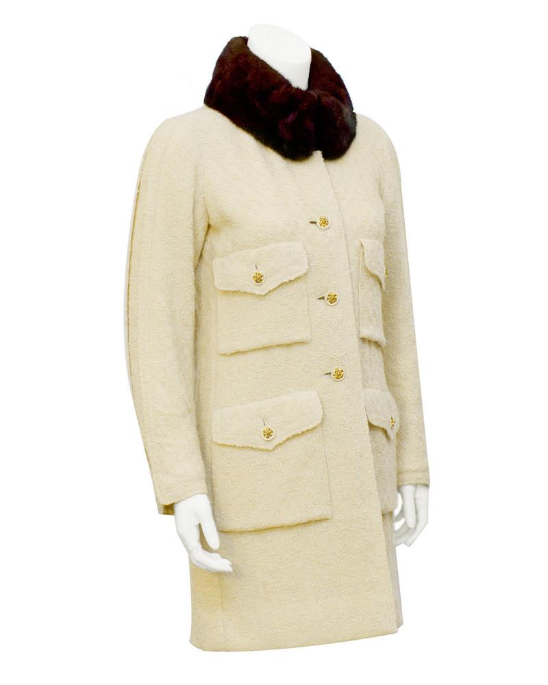 Chanel Couture Cream Couture Boucle Coat with Mink: Chanel 1980's Haute Couture cream boucle 3/4 length silk lined coat with chestnut brown mink collar. Unique cream and gold plated buttons on 4 flap pockets and down front. Fully lined in cream silk, a