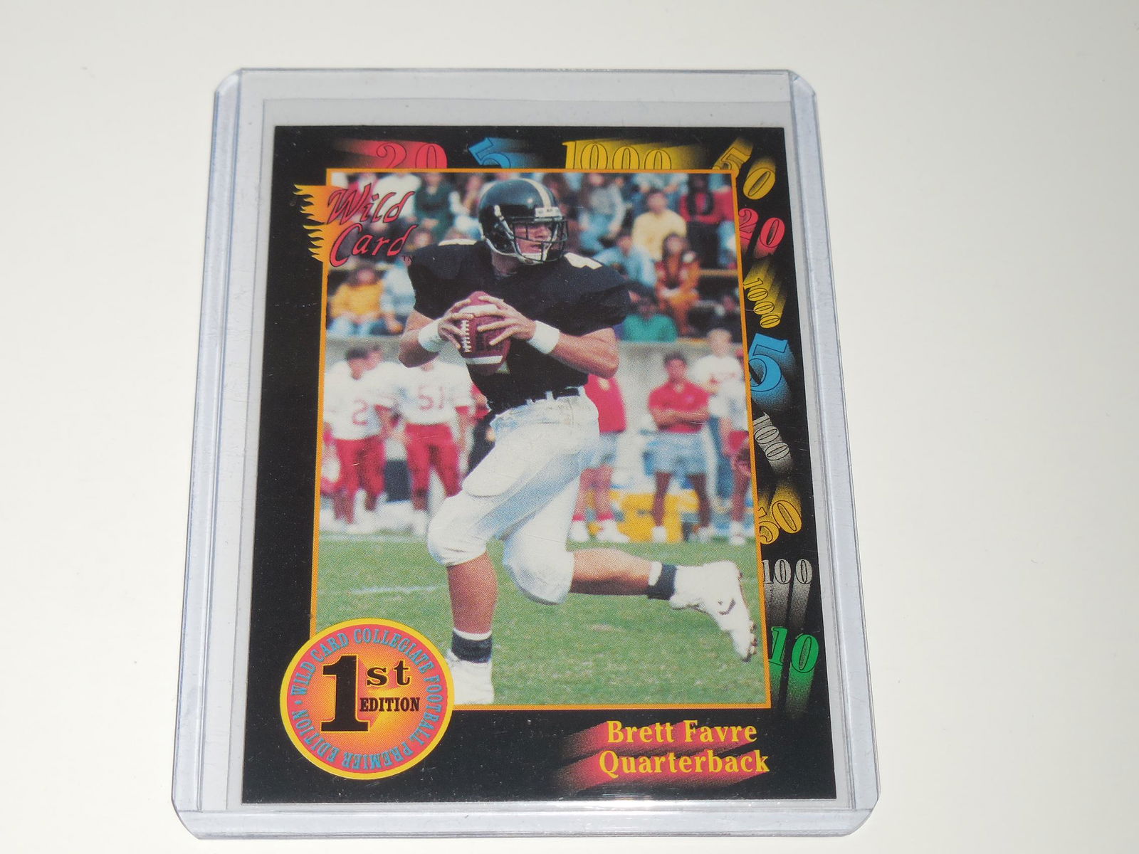1991 WILD CARD 1ST EDITION BRETT FAVRE ROOKIE CARD: Title: 1991 WILD CARD 1ST EDITION BRETT FAVRE ROOKIE CARD Description: FIRST EDITION BRETT FAVRE ROOKIE CARD! APPROXIMATELY NEAR MINT CONDITION COMES WITH SLEEVE AND TOP LOADER. Date/Period: MODERN Re