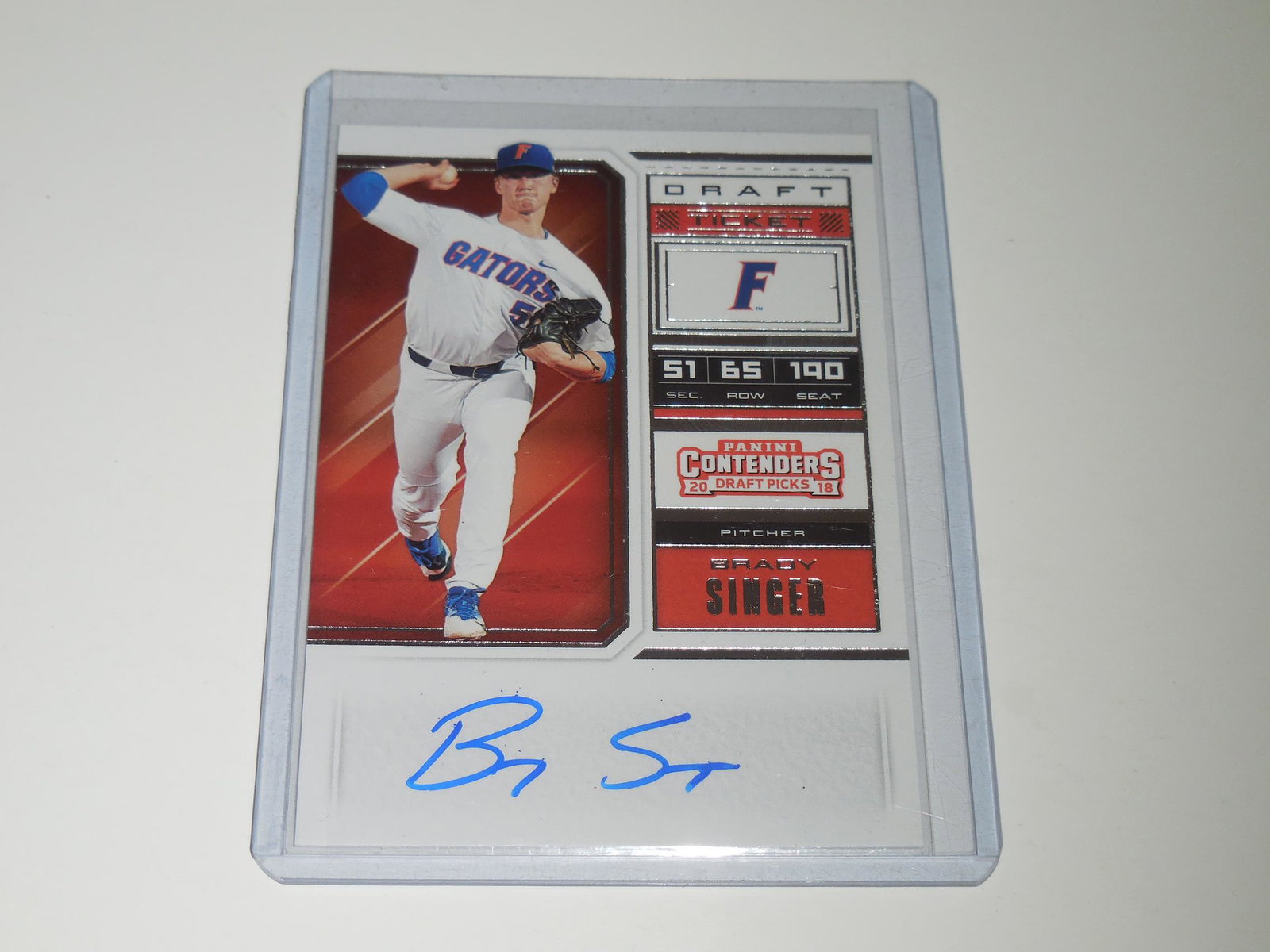 2018 CONTENDERS BRADY SINGER AUTO RC: Title: 2018 CONTENDERS BRADY SINGER AUTO RC Description: APPROXIMATELY NEAR MINT CONDITION COMES WITH SLEEVE AND TOP LOADER. Date/Period: MODERN Reserve: $3.00 Shipping: Domestic: Flat-rate of $5.00 t