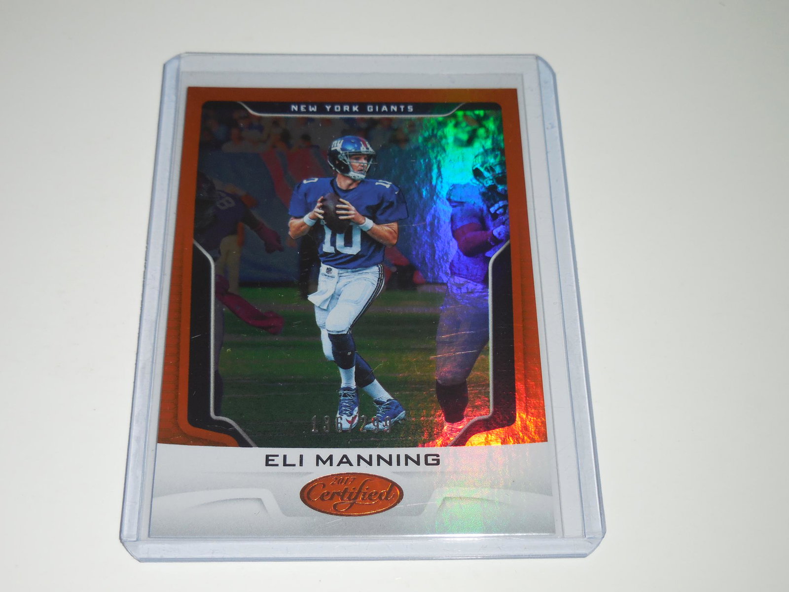2017 PANINI CERTIFIED ELI MANNING ORANGE HOLO #'D: Title: 2017 PANINI CERTIFIED ELI MANNING ORANGE HOLO #'D 136/299 Description: VERY NICE CARD. APPROXIMATELY NEAR MINT CONDITION. WILL SHIP WITH SLEEVE & TOP LOADER. Date/Period: MODERN Reserve: $2.00 