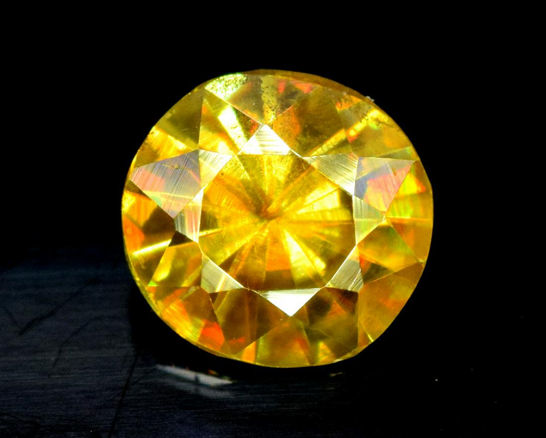 Sphene Full Fire Natural Loose Gemstone - 0.90 Carats -: Sphene Full Fire Natural Loose Gemstone - 0.90 Carats - 7*6*4 mm Weight : 0.90 Carats Size : 7*6*4 mm Origin : Pakistan Treatment : Natural Cut : Round Economy Shipping A1-36 Reserve: $45.00 Shippi