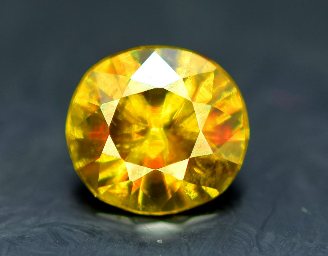 Sphene Full Fire Natural Loose Gemstone - 0.85 Carats -: Sphene Full Fire Natural Loose Gemstone - 0.85 Carats - 7*6*4 mm Weight : 0.85 Carats Size : 7*6*4 mm Origin : Pakistan Treatment : Natural Cut : Round Economy Shipping A1-82 Reserve: $40.00 Shippi