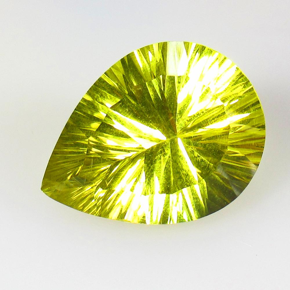 14.33 Ct Natural Lemon Quartz Concave Cut: Title: 14.33 Ct Natural Lemon Quartz Concave Cut Stone Clarity: VVS Gemstones: Natural Lemon Quartz Carat Weights: 14.33 Size/Dimensions: 20.00 x 15.30 x 10.30 mm Additional Information: Good Luster /