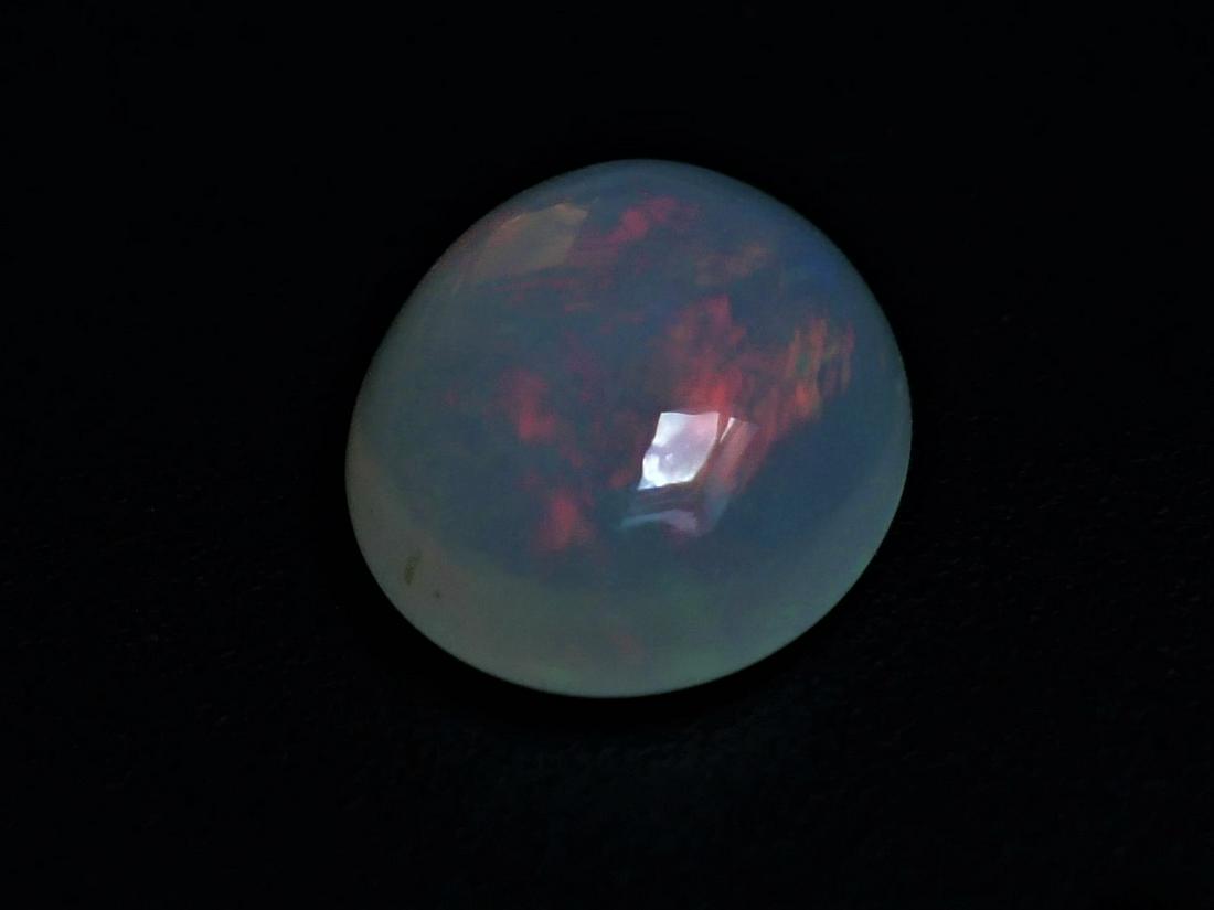 Opal Welo 1.85 ct: Title: Opal Welo 1.85 ct Gemstones: Opal Carat Weights: 1.85 ct Size/Dimensions: 10.20 x 8.20 x 3.60 mm Additional Information: Oval Mixed Cut Reserve: $10.00 Shipping: Domestic: Flat-rate of $10.00
