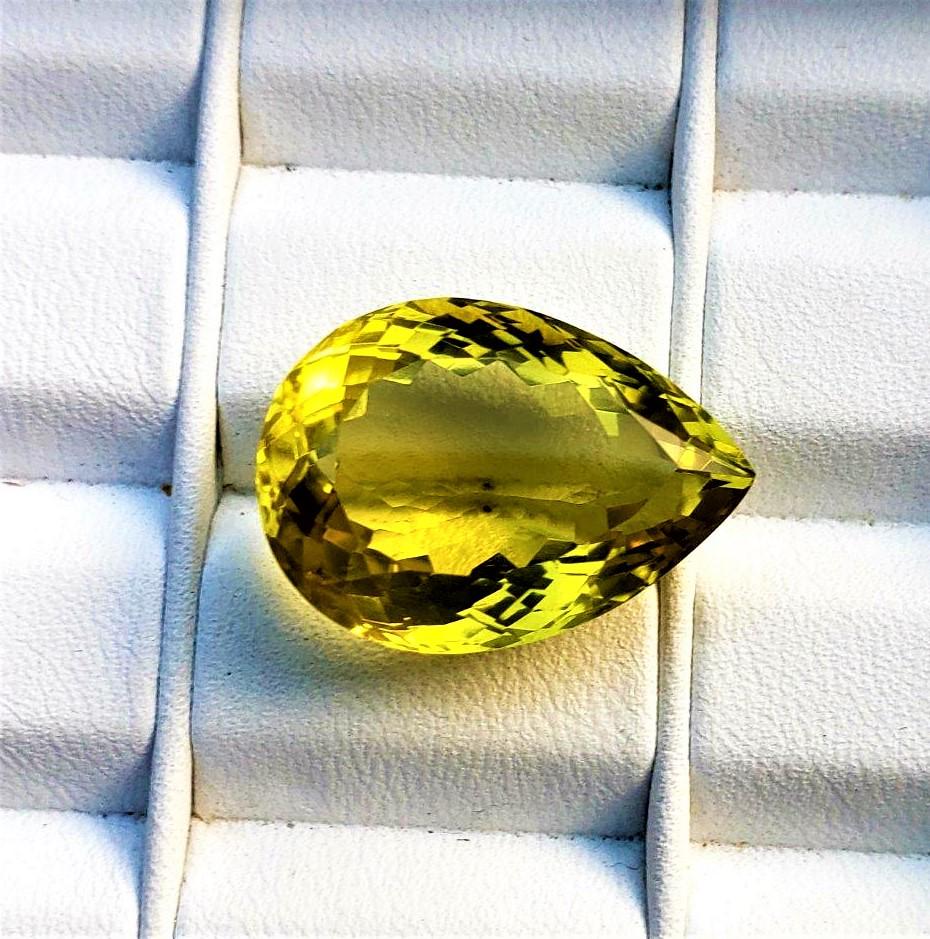 Pear Shape Flawless Lemon Quartz - 20.5 Carats: Title: Pear Shape Flawless Lemon Quartz - 20.5 Carats Gemstones: Lemon Quartz Carat Weights: 20.5 Carats Size/Dimensions: 22X16X11 mm Additional Information: Pear Shape Flawless Lemon Quartz - 20.5 Ca
