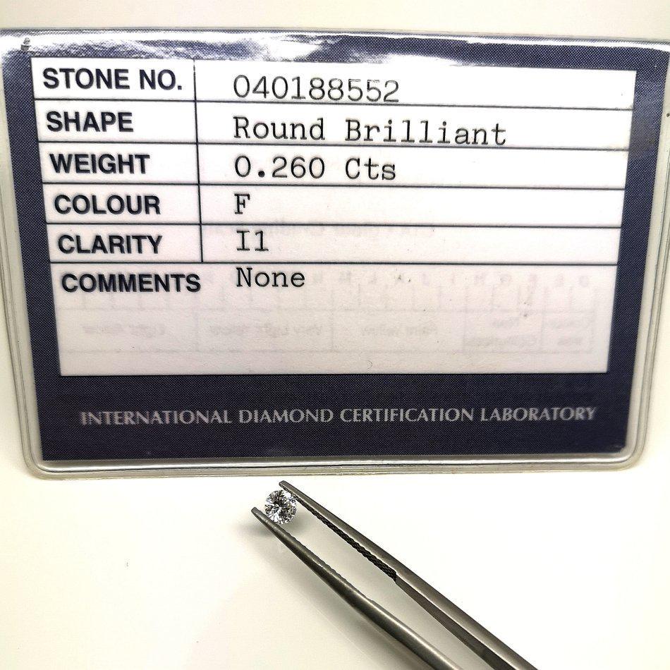 Natural White Diamond F 0.26ct with Certificate: Title: Natural White Diamond F 0.26ct with Certificate Additional Information: 1 x White Diamond - Shape: Round Brilliant - Weight: 0.26ct - Color: F - Clarity: I1 - Treatment: None - Certificate: DIA