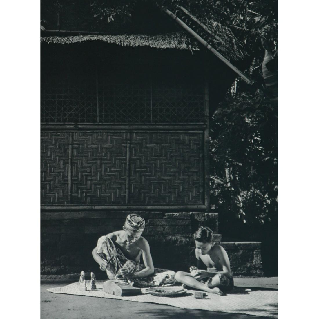 DRS. P. L. DRONKERS - The famous Ida Bagus Njana and: Artist: DRS. P. L. DRONKERS Print Title: The famous sculptor Ida Bagus Njana and his son and pupil Medium: Sheet-fed Gravure Printing Date: 1950s Printed in Indonesia Image Size approx.: 11 x 8.25 inc