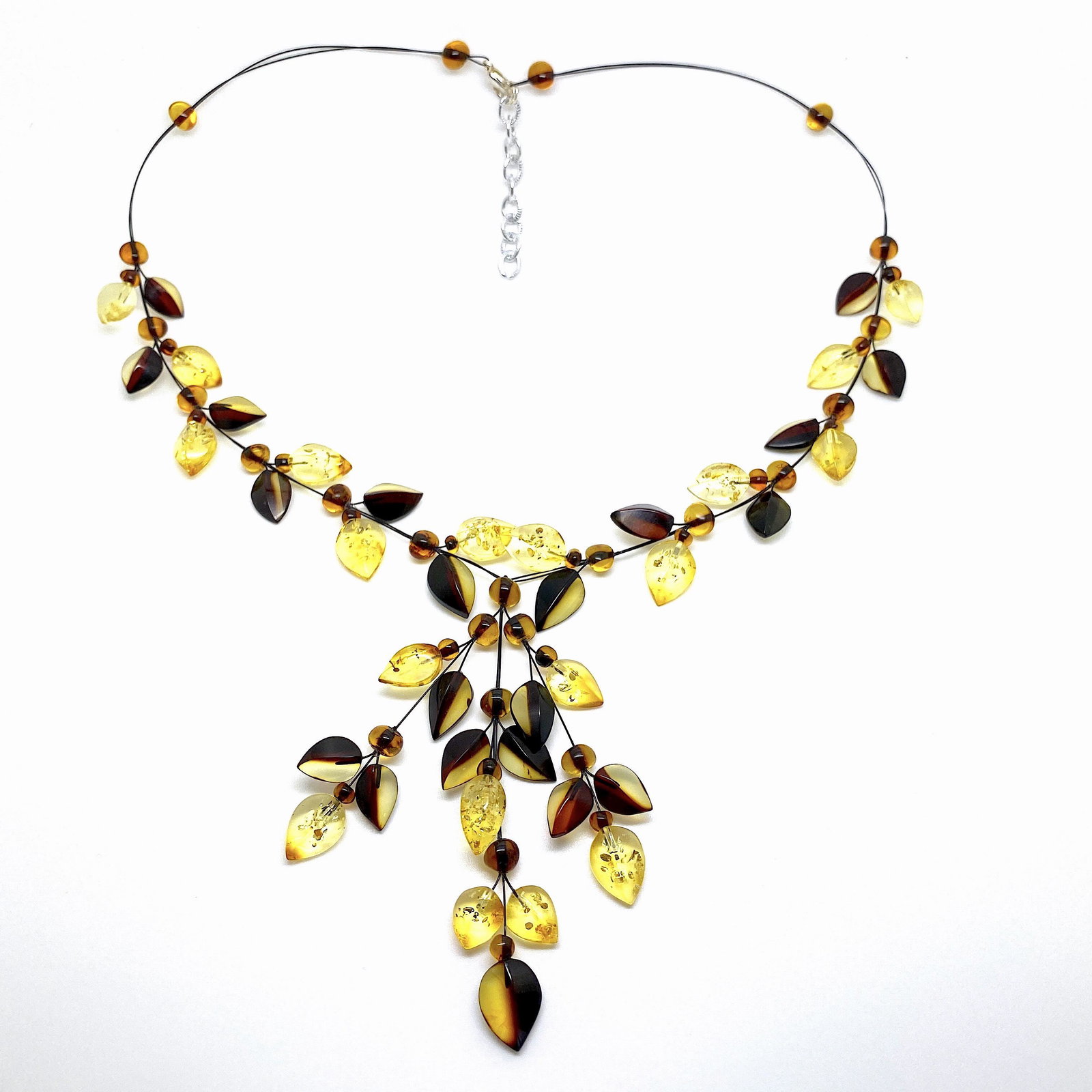Remarkable Amber Floral Necklace made from leaf like: Title: Remarkable Amber Floral Necklace made from leaf like bead ornaments Metal: None Gemstones: Amber Weight: 15.0 g Size: Size: 84.0 x 7.0 x 420.0 mm Size: 3.307 x 0.276 x 16.535 inches Made of: Wh