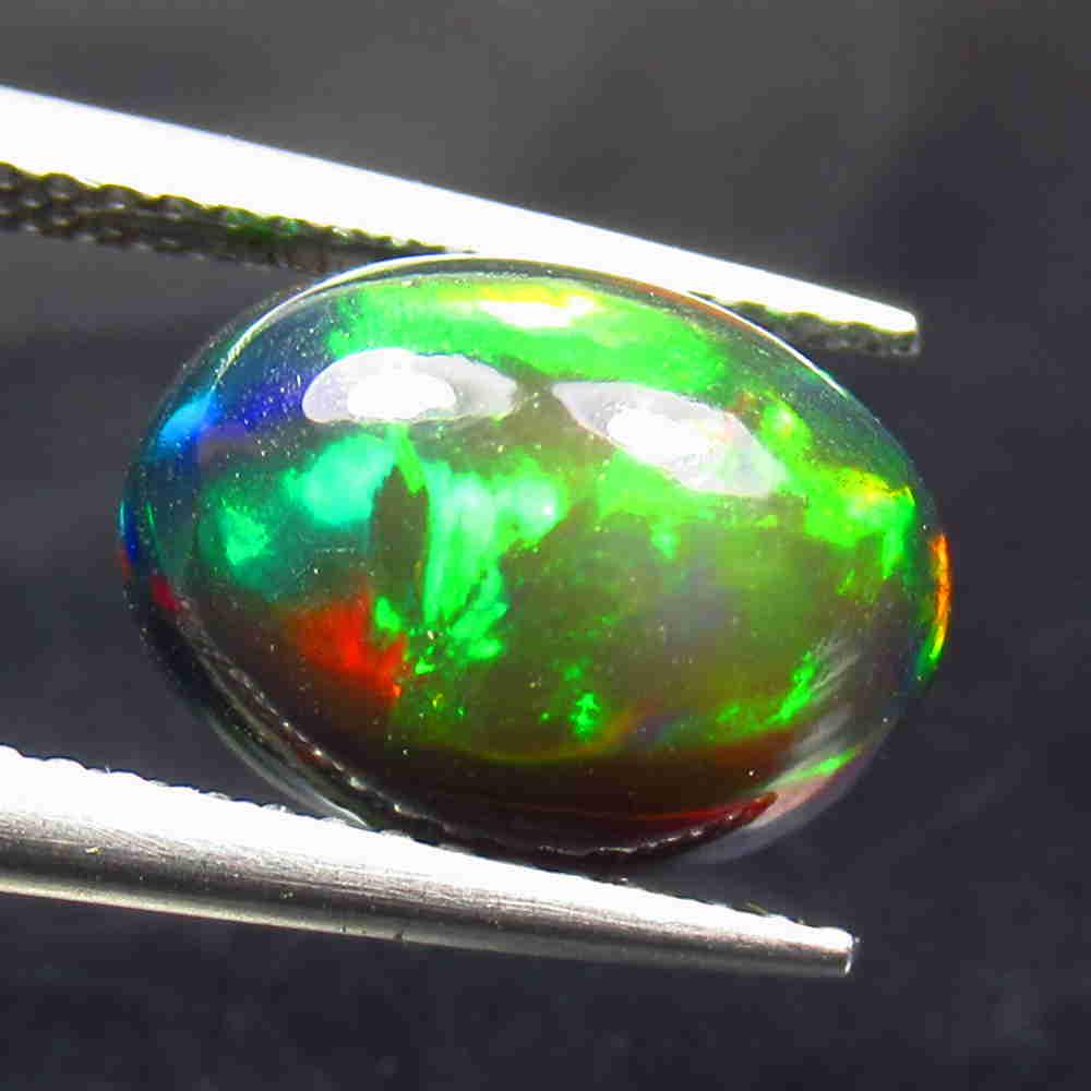 3.50 Ctw Natural Ethiopian Black Fire Opal Oval Cab: No Reserve! Title: 3.50 Ctw Natural Ethiopian Black Fire Opal Oval Cab Stone Clarity: Translucent Gemstones: Black Opal Carat Weights: 3.5 Size/Dimensions: 12.20 x 9.20 x 6.20 mm Additional Informatio