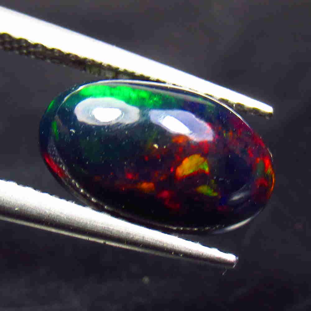1.88 Ctw Natural Ethiopian Black Fire Opal Oval Cab: No Reserve! Title: 1.88 Ctw Natural Ethiopian Black Fire Opal Oval Cab Stone Clarity: Translucent Gemstones: Black Opal Carat Weights: 1.88 Size/Dimensions: 12.20 x 7.40 x 4.70 mm Additional Informati