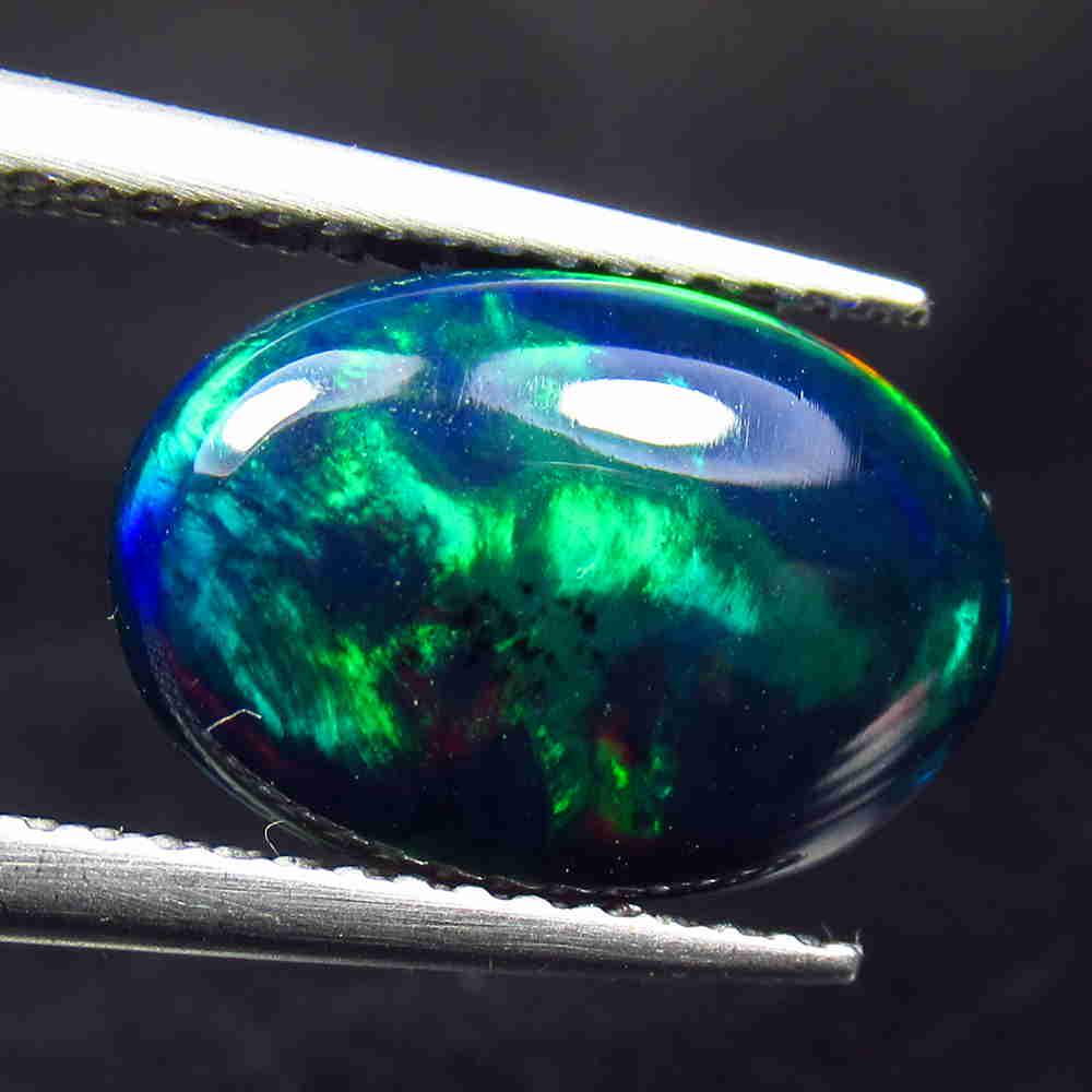 1.94 Ctw Natural Ethiopian Black Fire Opal Oval Cab: No Reserve! Title: 1.94 Ctw Natural Ethiopian Black Fire Opal Oval Cab Stone Clarity: Translucent Gemstones: Black Opal Carat Weights: 1.94 Size/Dimensions: 13.40 x 9.20 x 3.30 mm Additional Informati