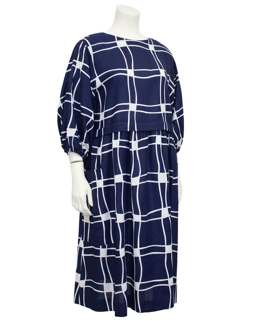 Guy Laroche Navy Blue and White Cotton Dress: Adorable 1980s Guy Laroche cotton/linen blend midi peasant dress. Graphic navy blue and white pattern. Designed to fit slightly oversized and look like a top and skirt ensemble. Round neckline and 3/4