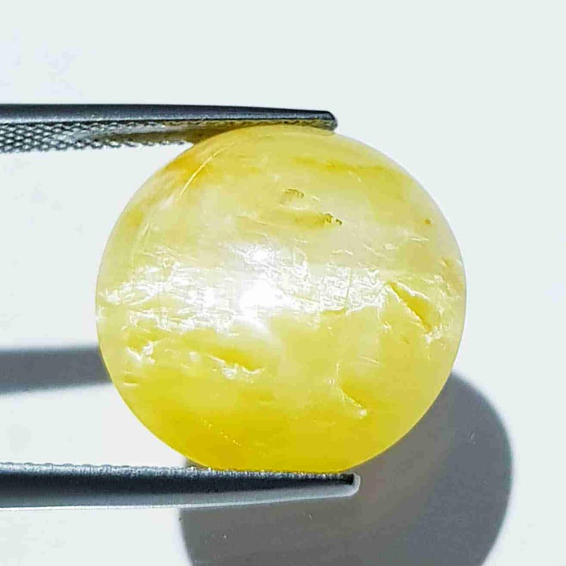 13.34 ct Natural Opal Cat's Eye: No Reserve! Title: 13.34 ct Natural Opal Cat's Eye Color/Clarity: Semi Transparent Gemstones: Loosegemstone Carat Weights: 13.34 Size/Dimensions: 17.30 x 8.50 x 8.50 Additional Information: Round - Af