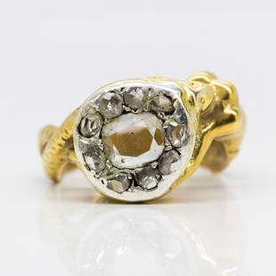 Antique Georgian 18k Diamond Ring: Handmade in 18k gold during the Georgian period in the early 1800´s, this authentic antique displays a rose cut diamond of J-SI1 quality that weighs 0.40ctw. The center stone is surrounded by 9