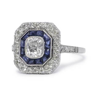 Art Deco Inspired Antique Old Diamond & Sapphire Ring: One gorgeous old mine cut diamond of J-VS1 quality that weighs 0.85ctw is set in an equally beautiful halo of sapphires and diamonds. The diamonds are old mine cut of H-VS1 quality that weigh 0.45ctw