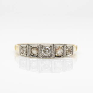 Art Deco 18k Gold and Platinum Diamond Ring: Handmade in 18k gold and platinum on the top, this exquisite ring was handmade during the Art Deco period in 1920´s. This ring features 5 rose cut diamonds of J-SI1 quality that weigh 0.30ctw. 